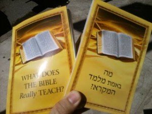 Jehovah's Witness conduct studies with interested ones using the "Bible Teach" book