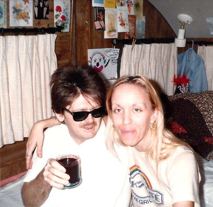Donald wore sunglasses a few days before his death, as his eyes became sensitive to light. Here he is drinking beet juice while his exhausted wife, Carole, sits beside him on the bed